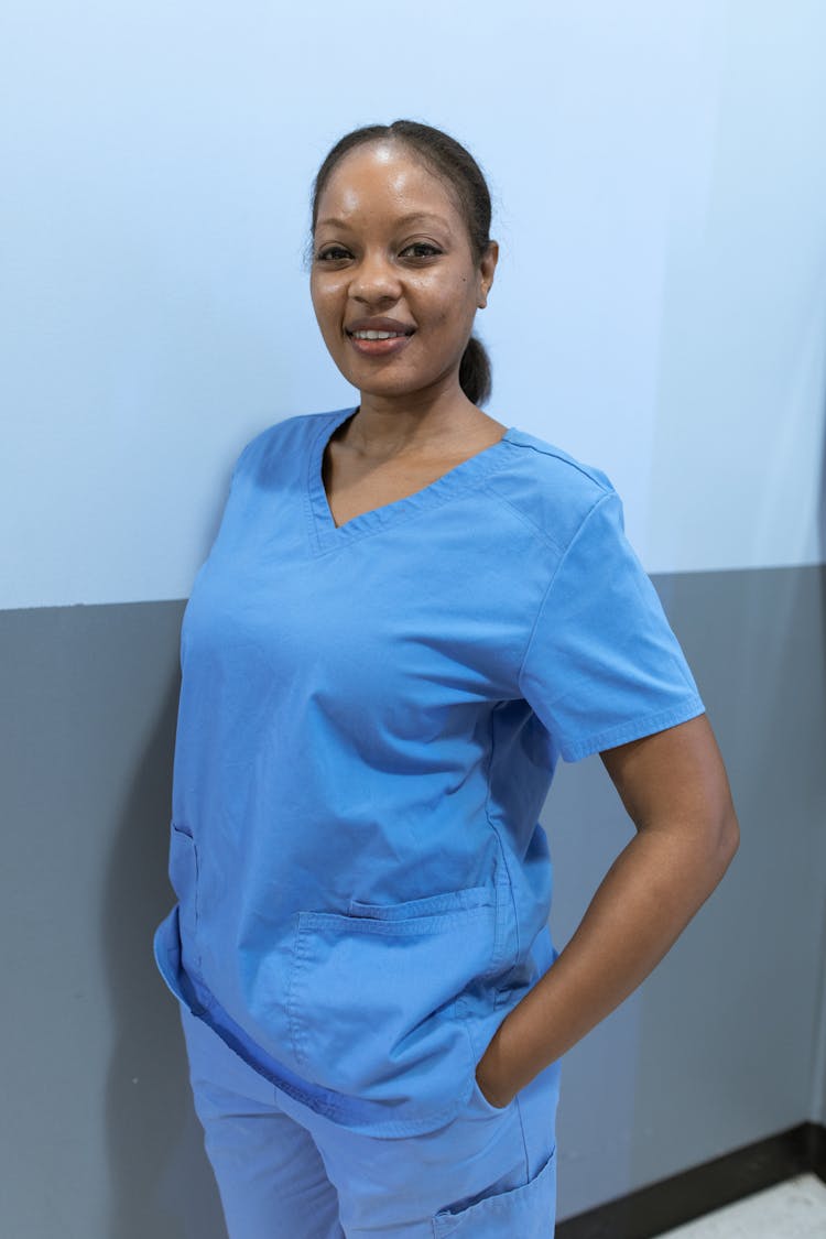 Nurse Wearing A Scrub Suit Smiling