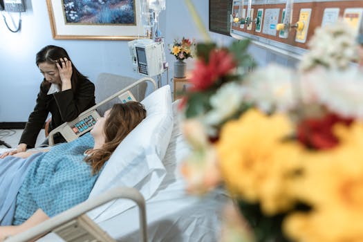 Woman visiting a patient in a hospital room, showing care and comfort.