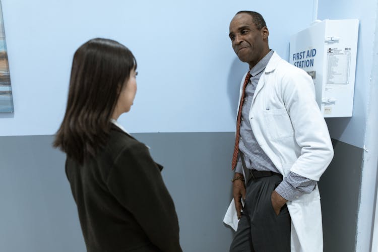 Male Doctor Talking To A Patient 