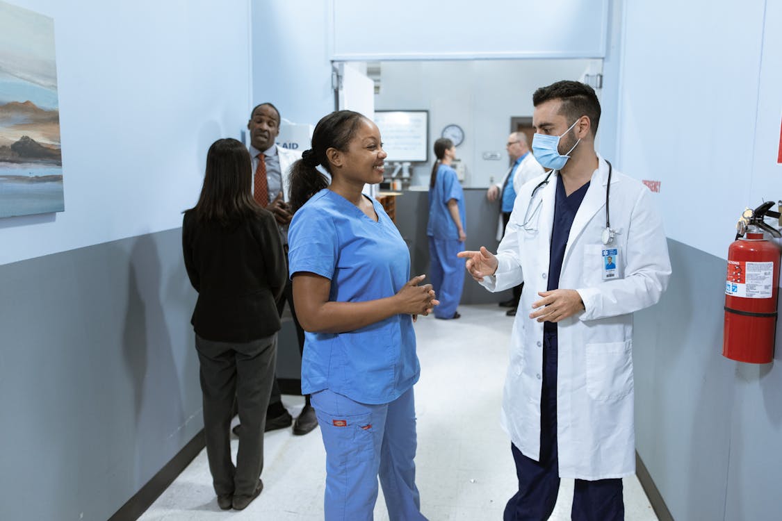 Free Medical Practitioners having a Discussion Stock Photo