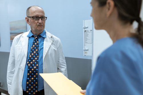 Free Doctors discussing at a medical clinic. Healthcare team collaboration. Stock Photo