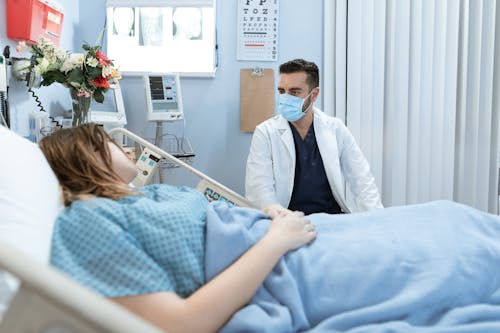Free Doctor talking to a Patient  Stock Photo