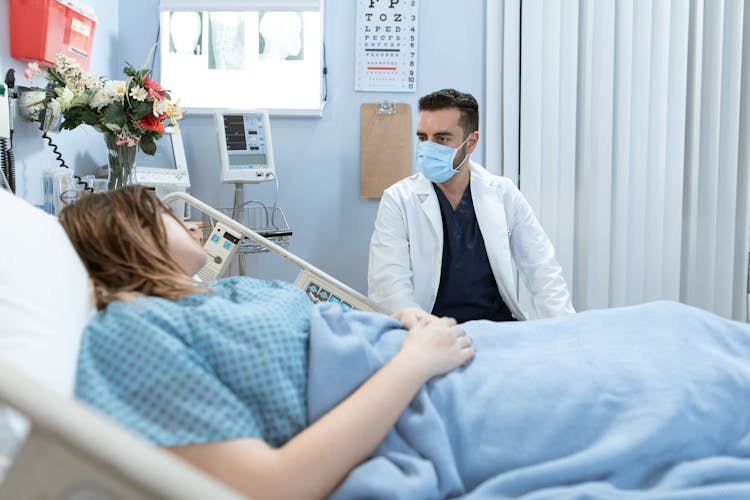 Doctor Talking To A Patient 