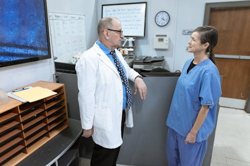 Free Medical Practitioners having a Discussion Stock Photo