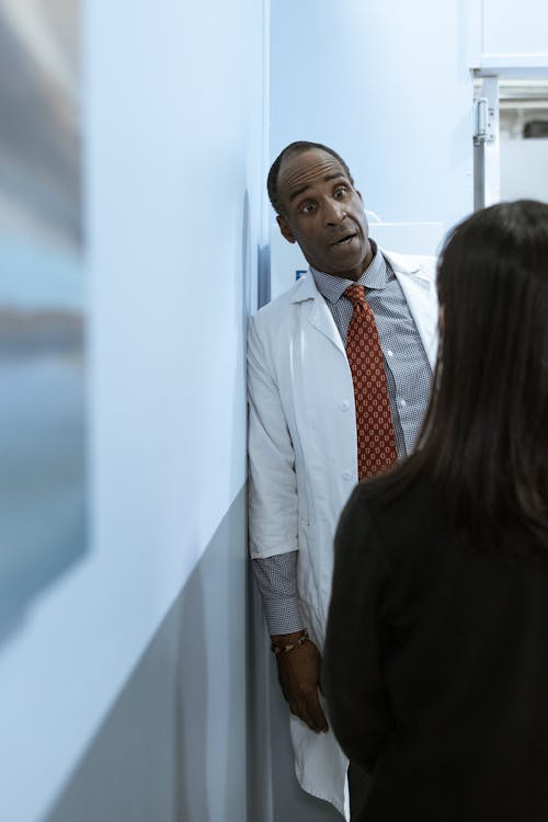 Free Male Doctor talking to a Patient Stock Photo