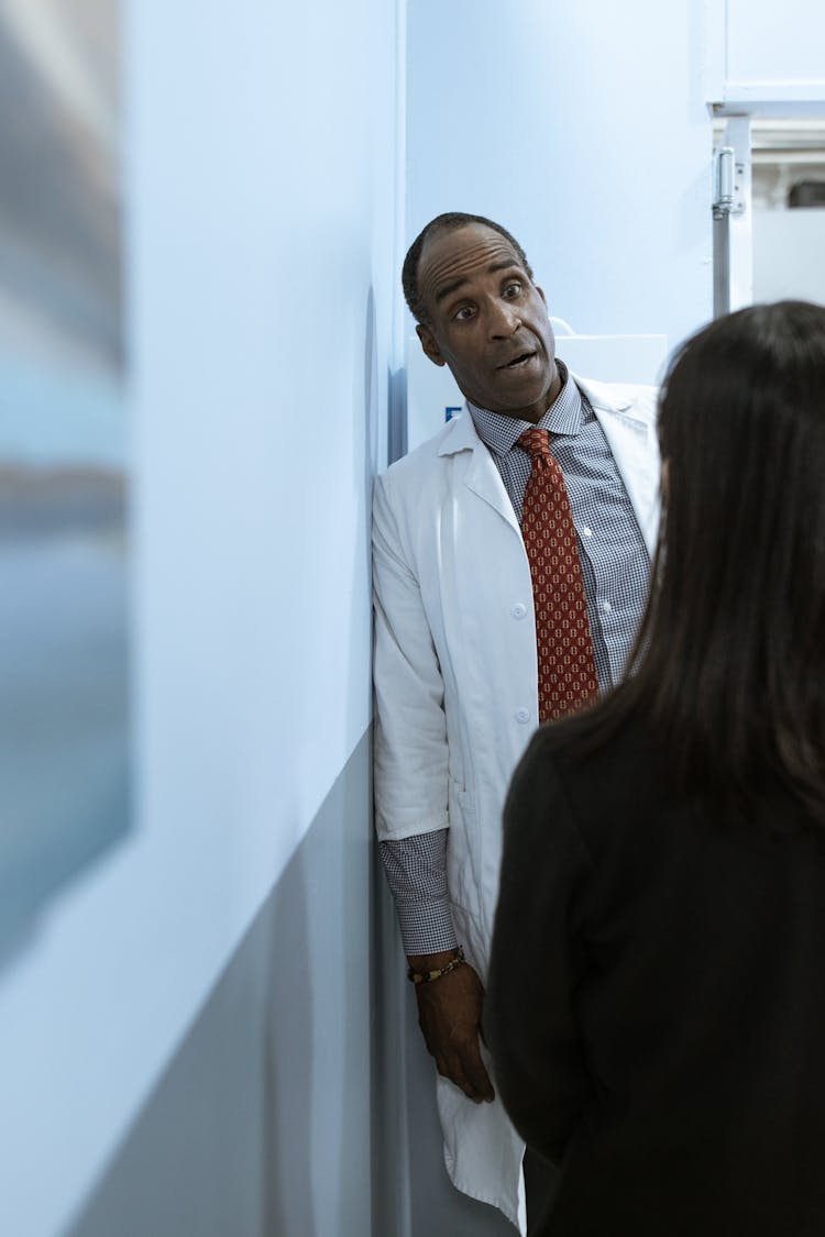 Male Doctor Talking To A Patient