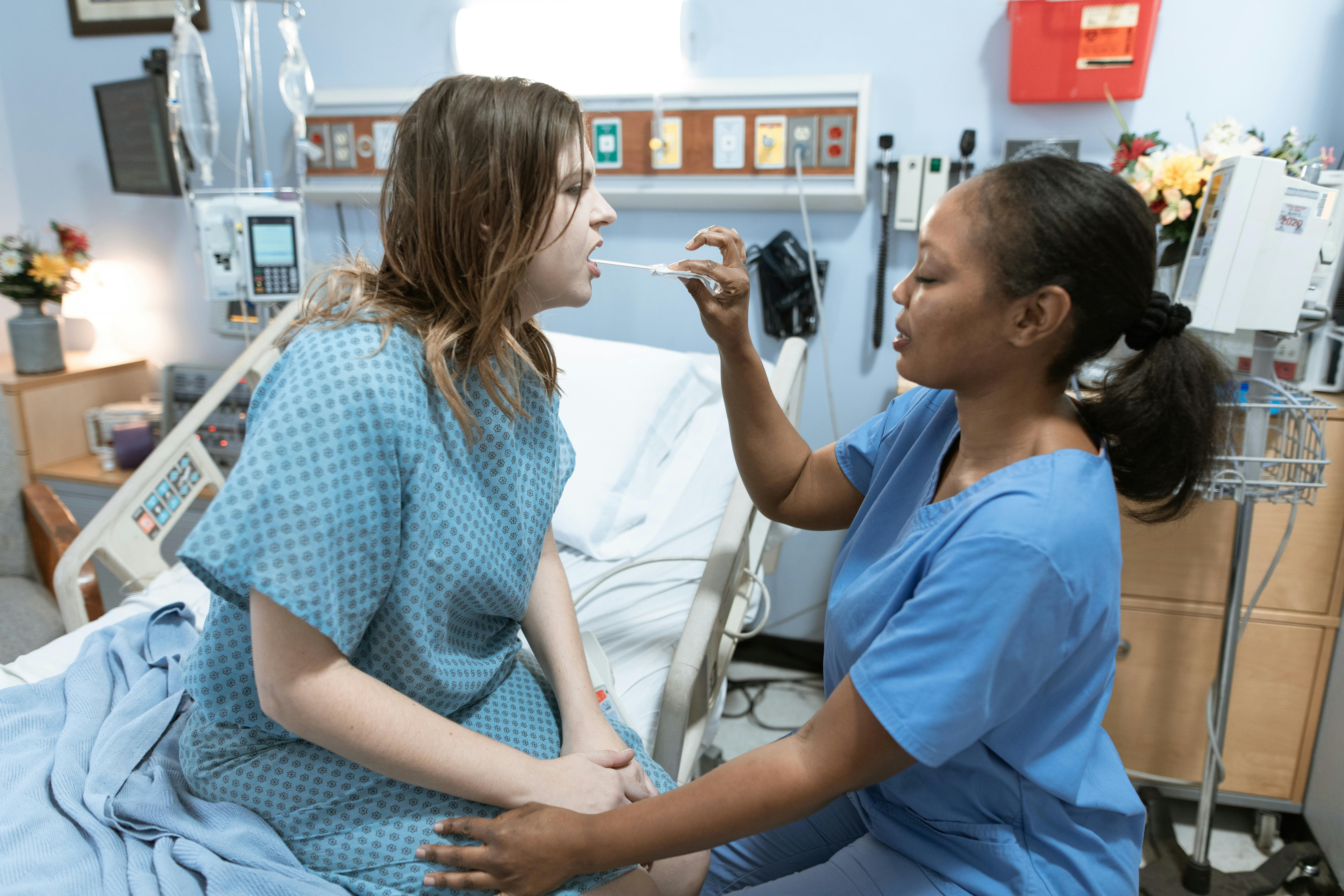 nurse taking sample from a patient