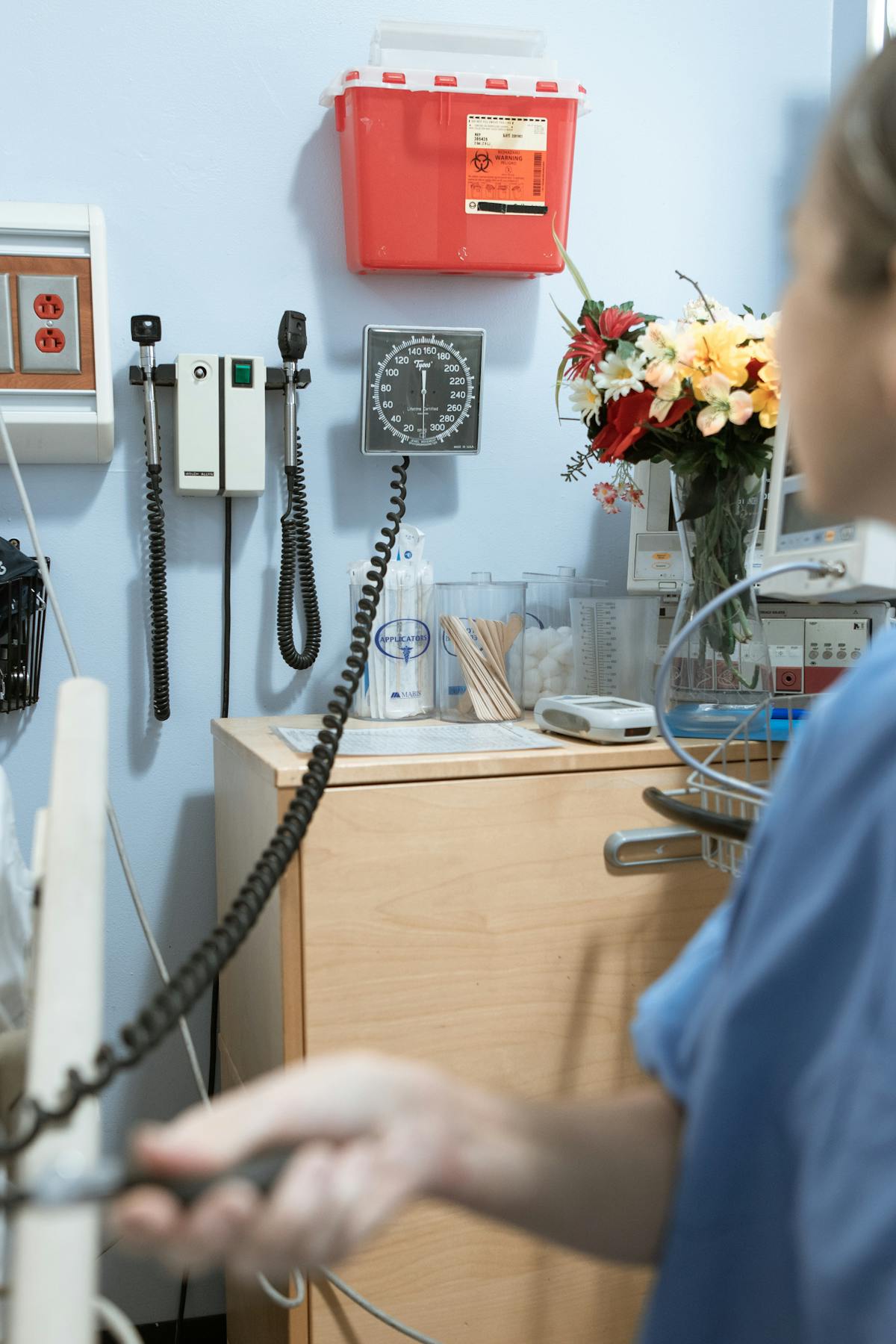 Doctor examining a patient with a stethoscope in a clinical setting