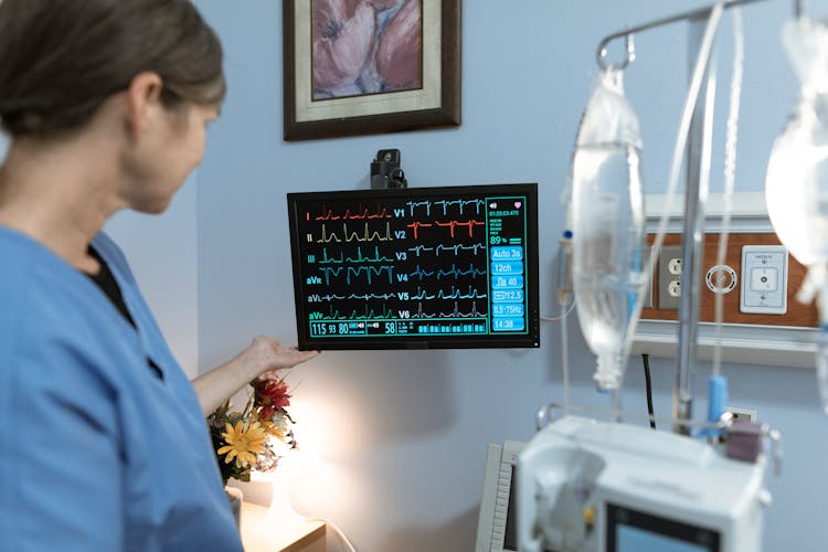 Nurse Looking At A Monitor 