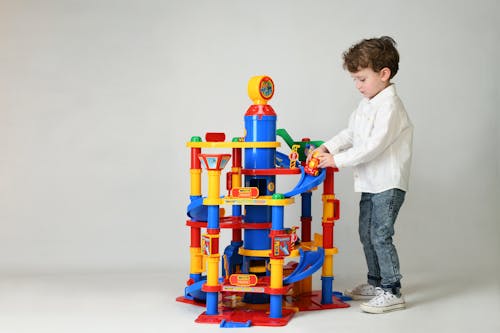 A Young Boy Playing Toys