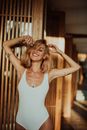 Happy Woman in White One-Piece Swimwear