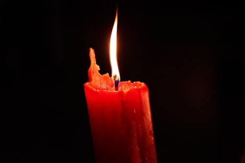 Free Red Pillar Candle With Black Background Stock Photo