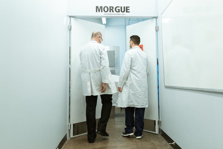 Two Doctors Entering A Morgue 