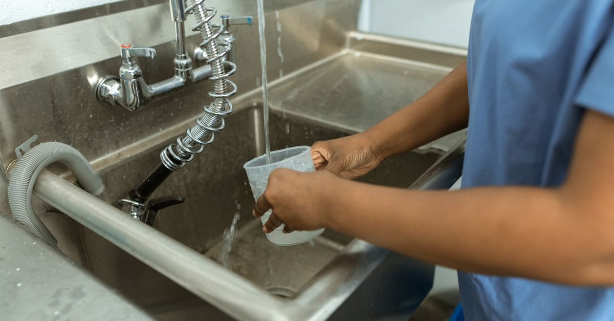Clean Container Example Cleaning of Plastic Container by a Person · Free Stock Photo