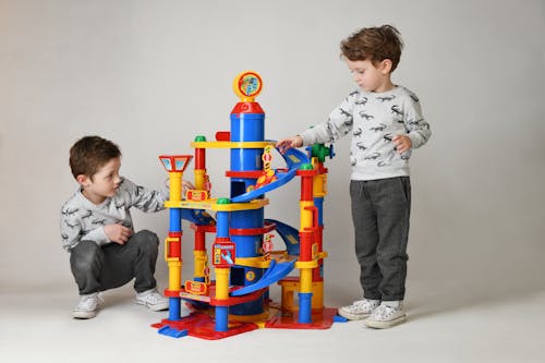 Free Young Boys playing Park Tower Toy  Stock Photo