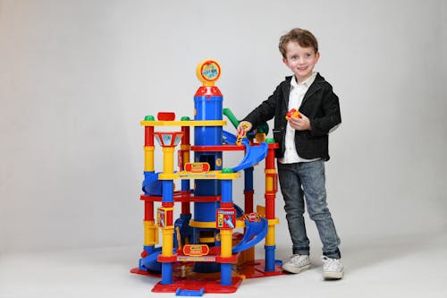 Free Young Boy playing Park Tower Toy Stock Photo