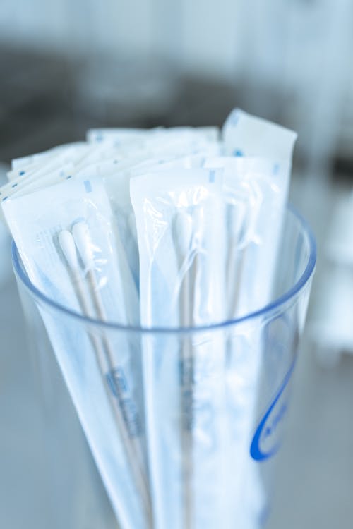 Close-up Photo of Glass of Cotton Swabs 