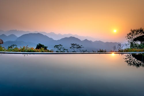 Free Calm lake and mountains in evening Stock Photo