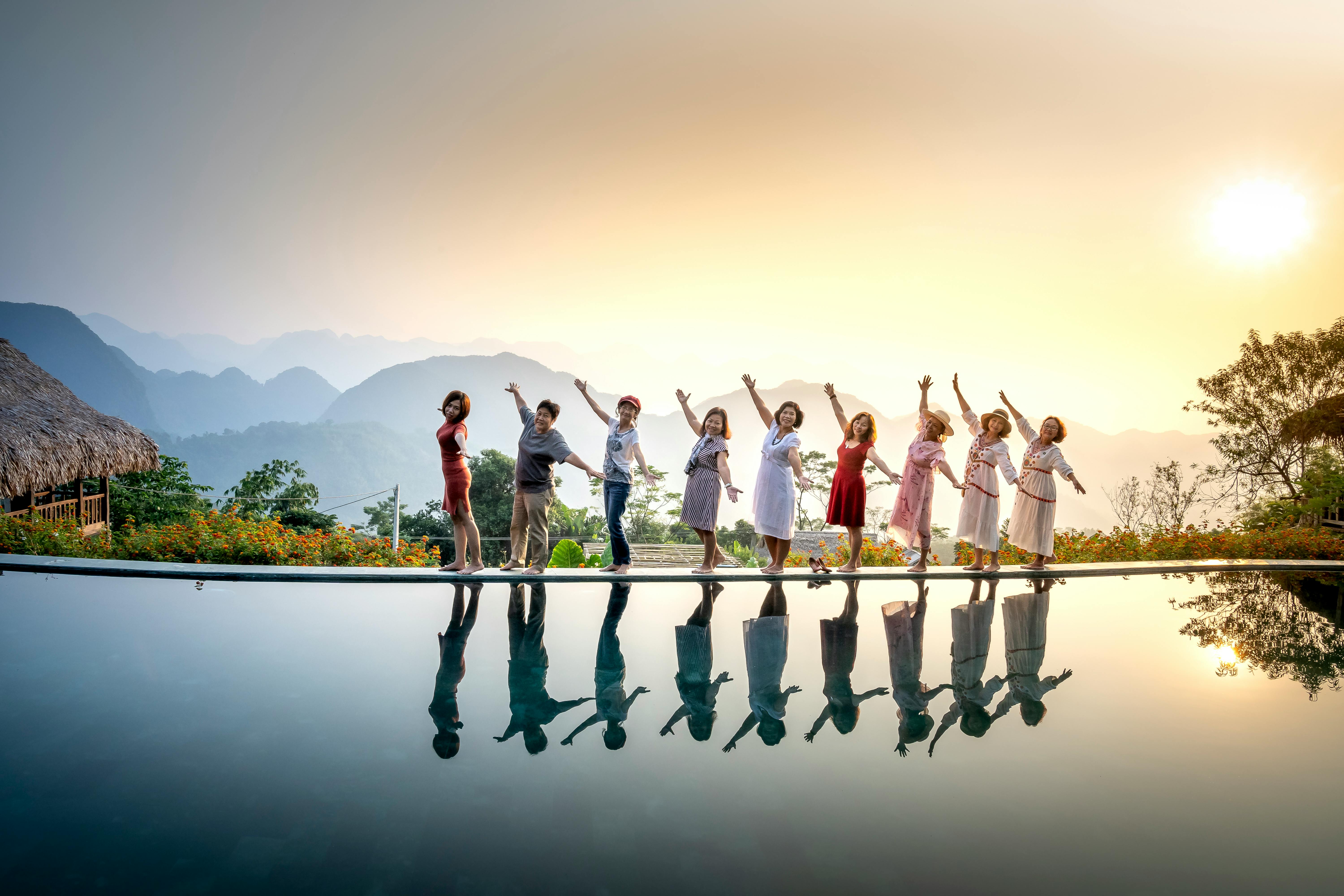 cheerful women enjoying tropical place together