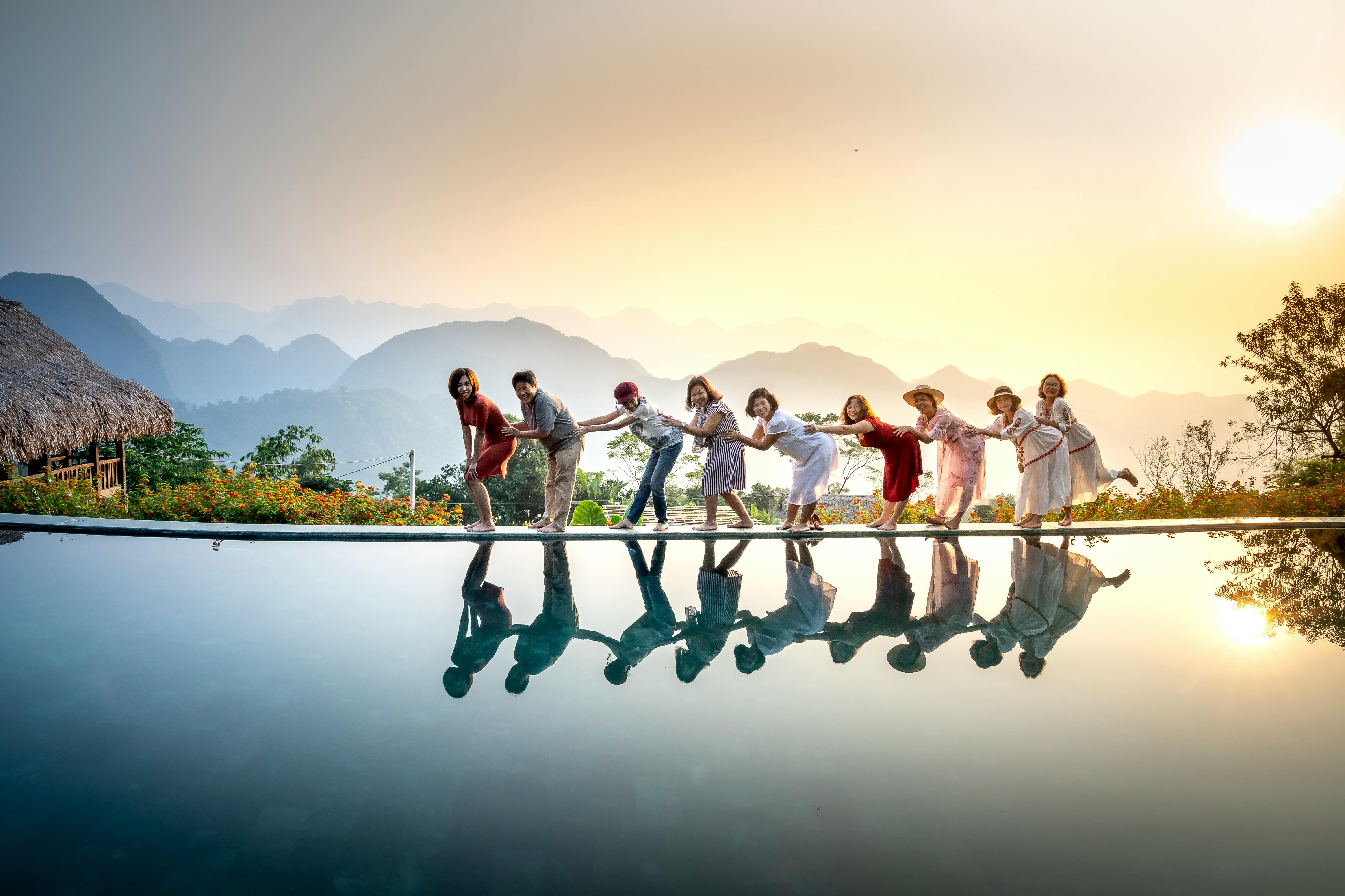 happy friends enjoying tropical vacation together