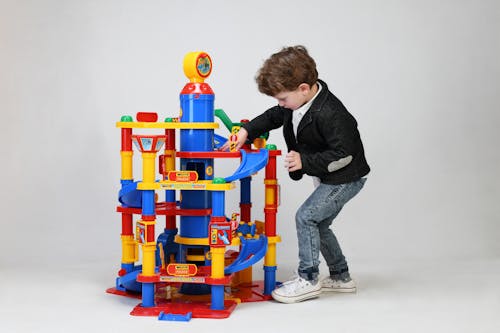 Free Young Boy playing Park Tower Toy Stock Photo