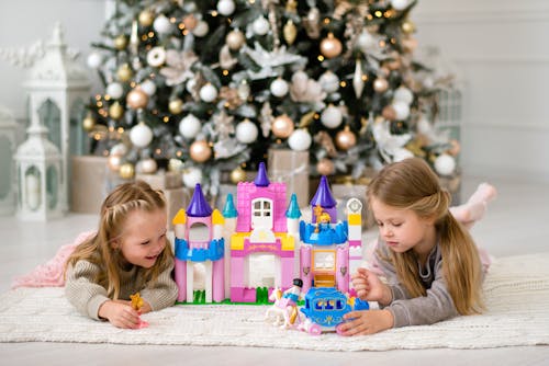 Free Young Girls playing Castle Themed Toys  Stock Photo