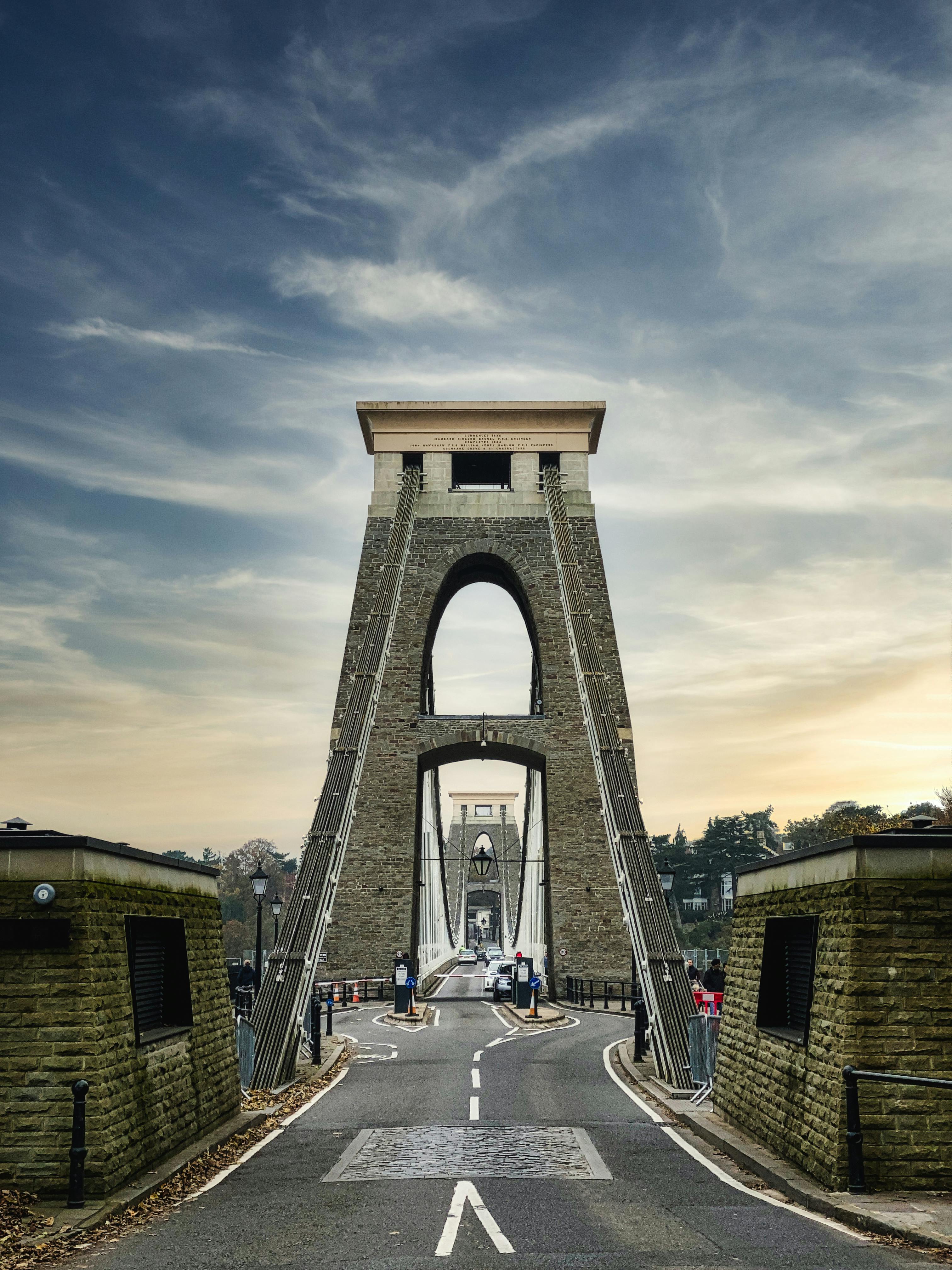 Brown Concrete Bridge Under Cloudy Sky