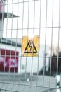 Sign of high voltage on fence