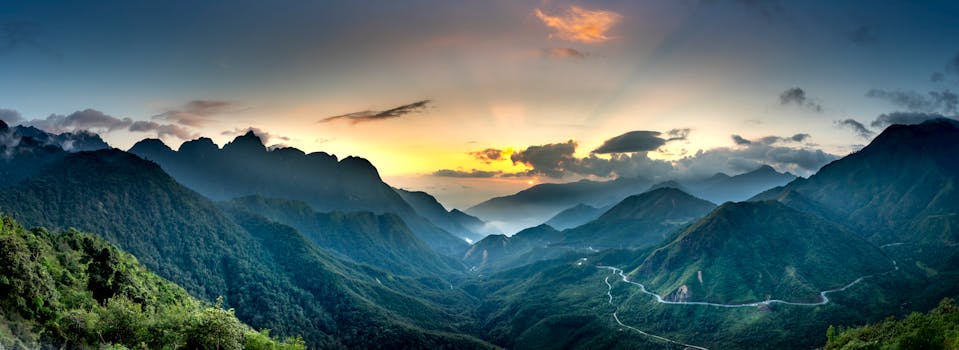 Breathtaking view of mountain ranges and misty valleys at sunset. Perfect for nature lovers.