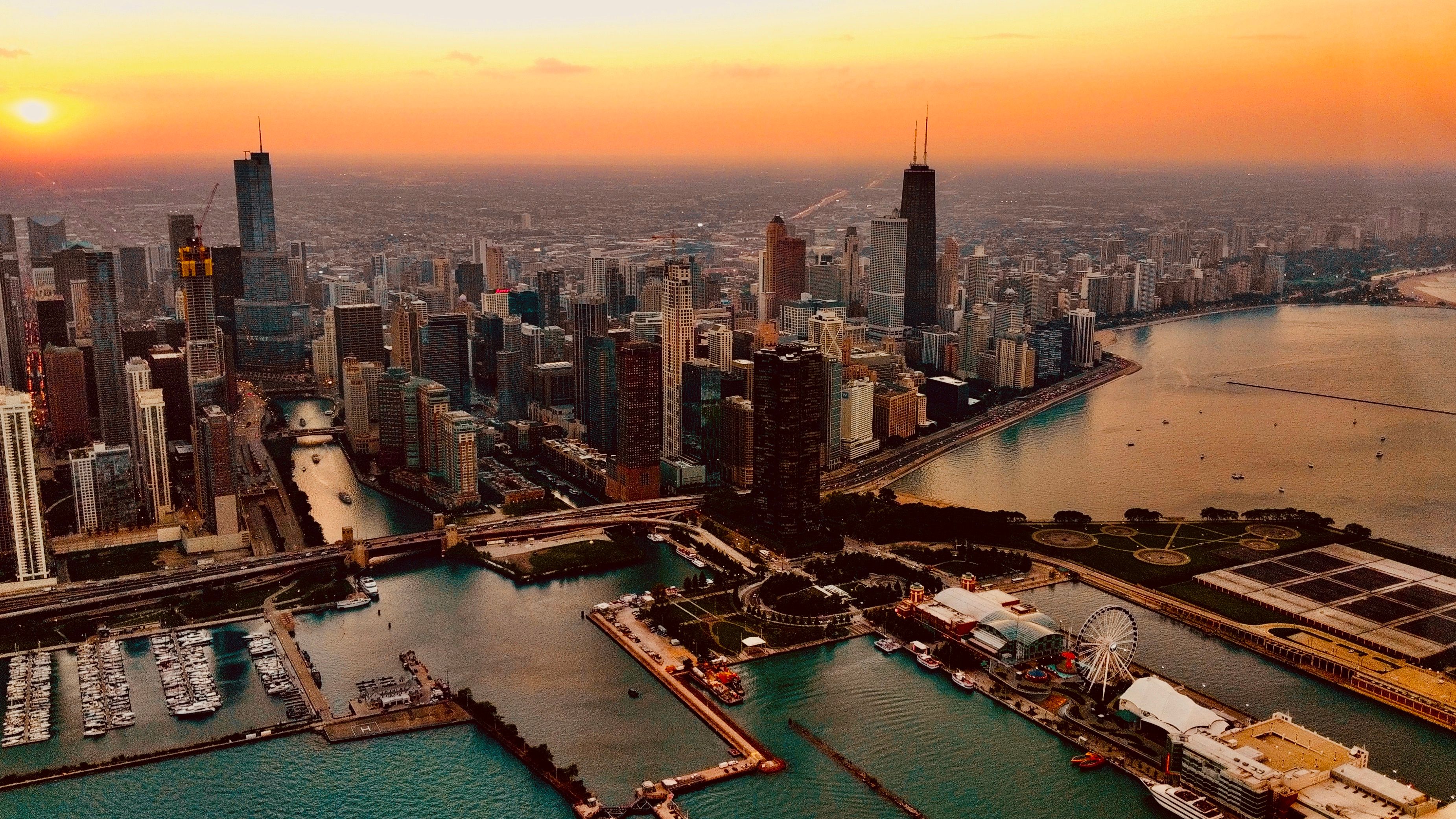 Stunning Private Downtown Detroit Helicopter Ride Review: Experience the Motor City from Above Review 2026 - Stunning aerial shot of Chicago skyline with vibrant sunset hues over Lake Michigan.