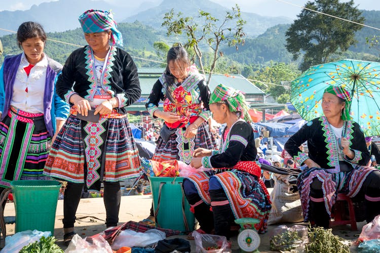 Asian Vendors In Traditional Wear In Local Market