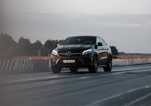 Free A Black Mercedes Benz on the Road Stock Photo