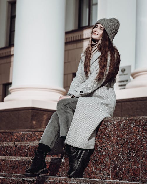 Portrait of a Long-haired Fashion Model Wearing a Gray Coat