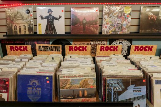Vintage vinyl records displayed in a classic music store with a retro vibe.