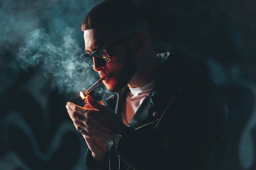 Free Close-Up Shot of a Man in Black Leather Jacket Smoking Stock Photo