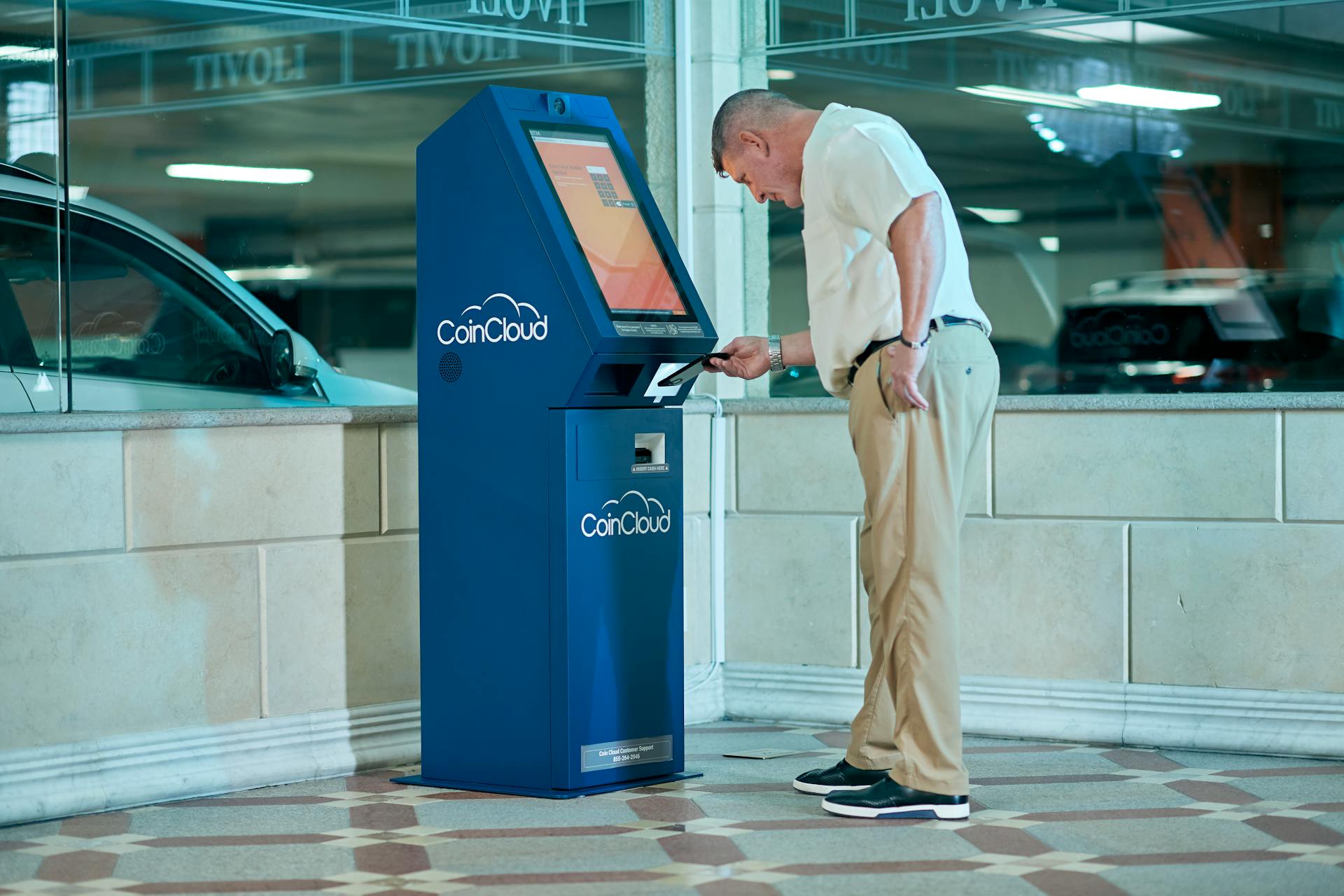 A Man using Coin Cloud Machine