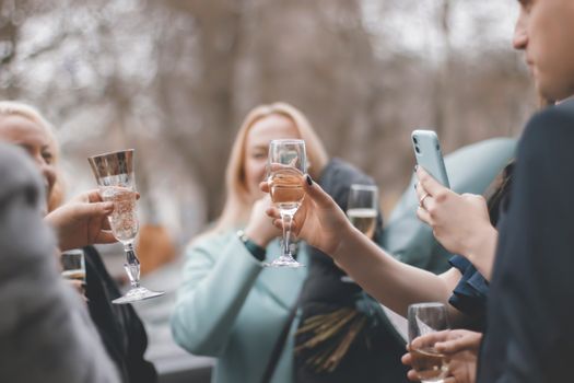 group toasting wine glasses