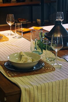 Chic dining setup in Marseille with wine glasses and decorative tableware. Perfect for elegant dining themes.