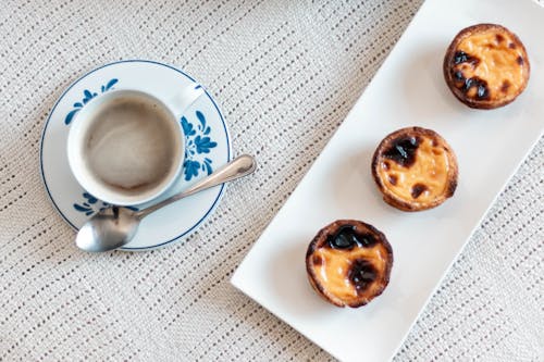 Free Round Pastries on White Ceramic Plate Stock Photo