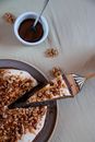 Stainless Steel Fork on White Ceramic Plate Beside Brown Ceramic Mug