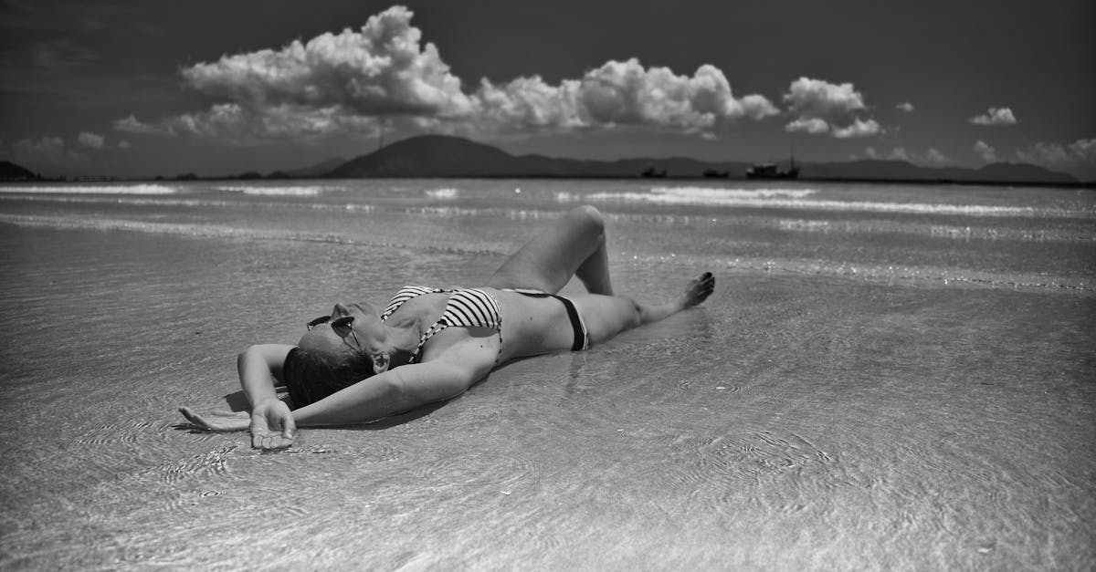 A woman in a bikini enjoys the tranquility of Ninh Hòa's beach.