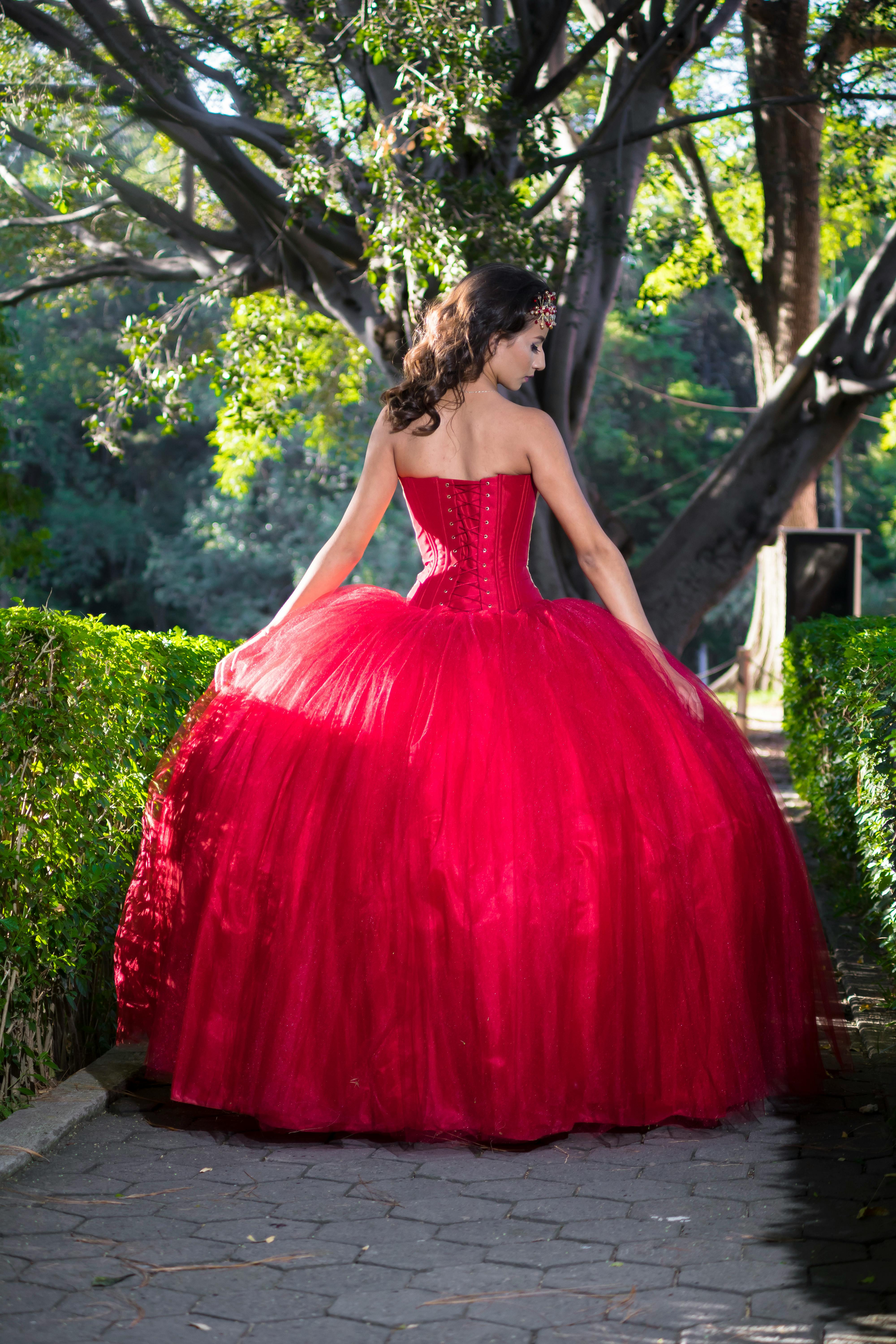 A Woman Wearing a Red Gown · Free Stock Photo