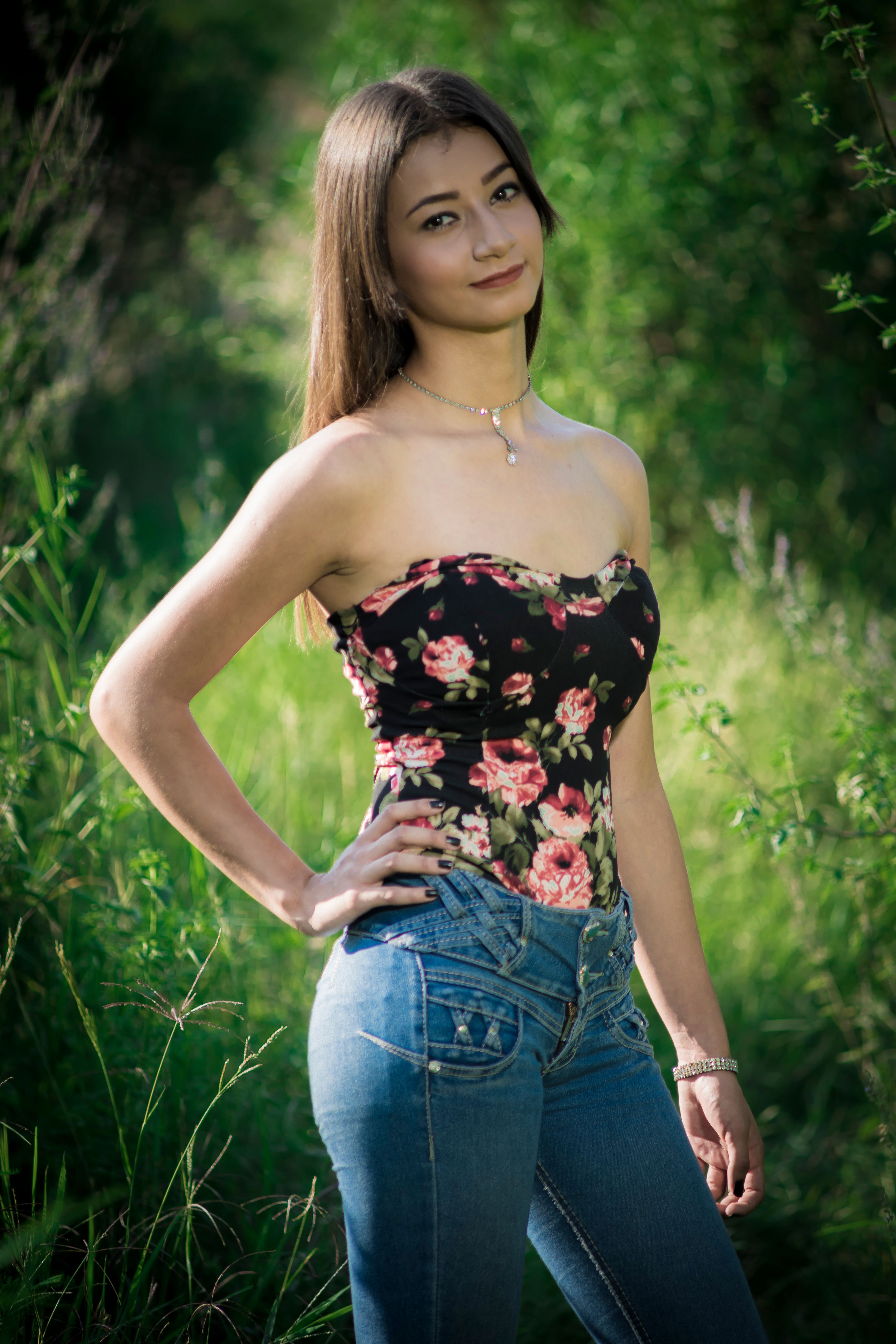 A Pretty Woman Wearing a Floral Top · Free Stock Photo
