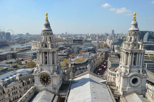Aerial shot capturing St Paul's Cathedral towers with the London skyline on a clear day.