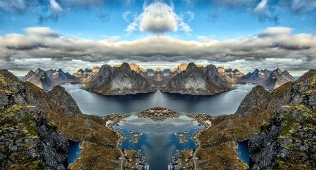 Body of Water Near Mountain Under Blue Sky
