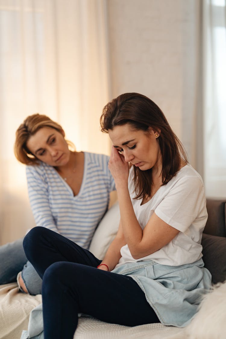 Mother Comforting Grownup Daughter