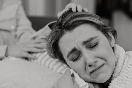 Grayscale Photo of  A Woman Crying