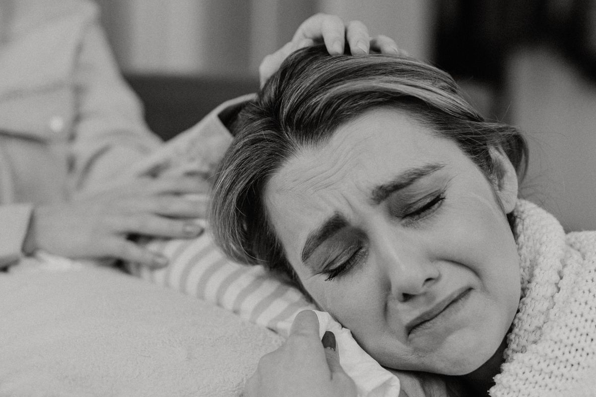 Person crying over lost friendship