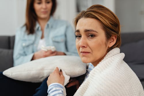 Woman in White Sweater Crying With Tears
