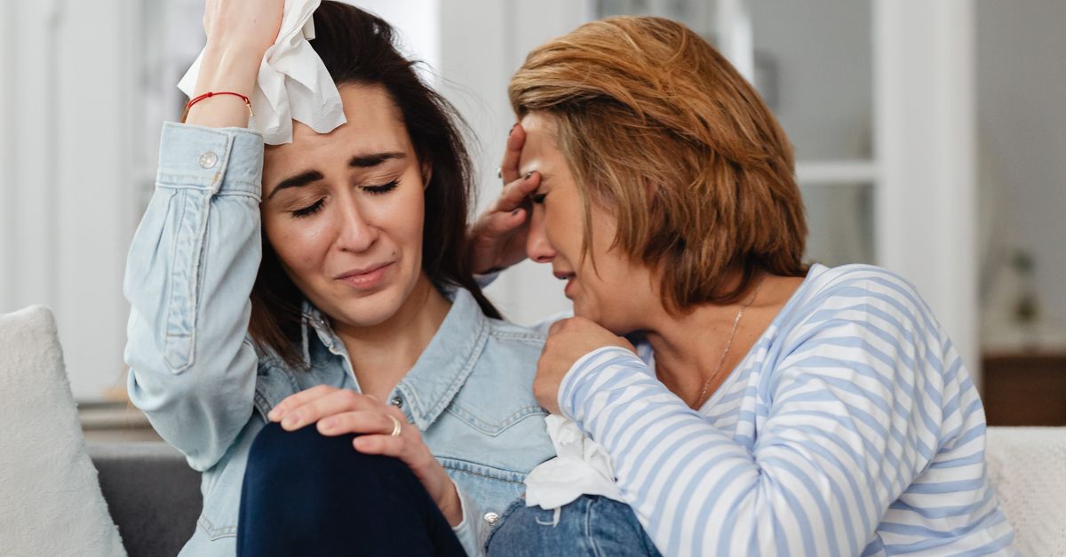 Both Crying Photo of Women Sitting Together while Crying · Free Stock Photo